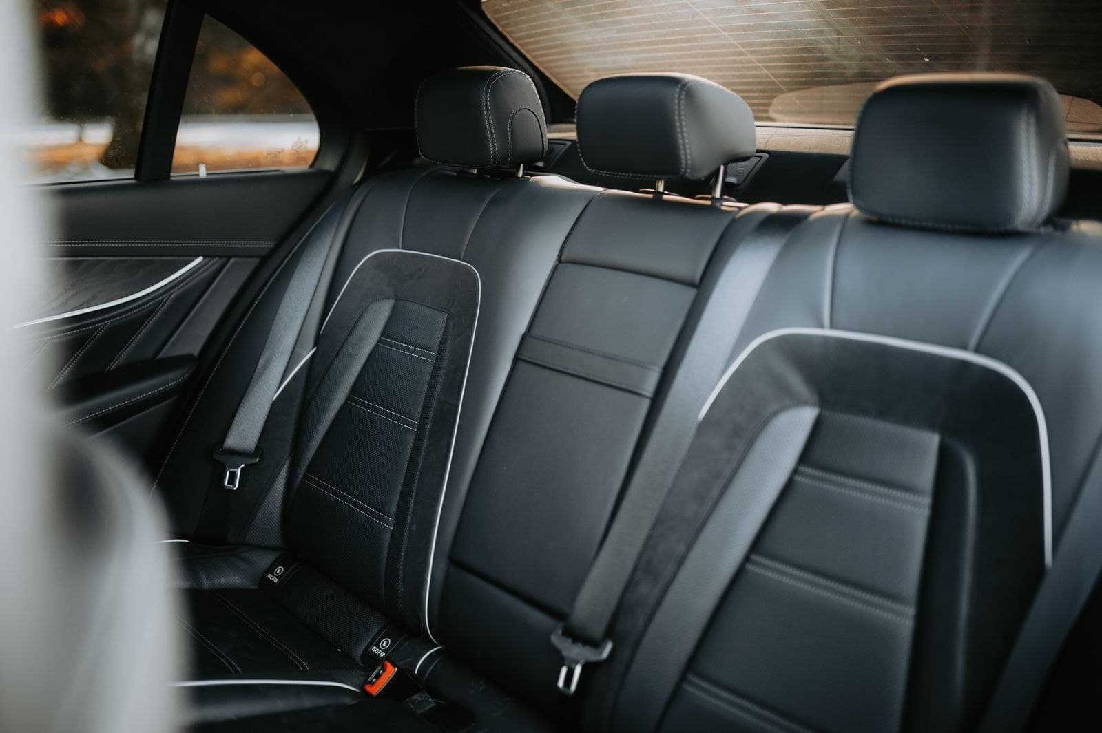 Black leather executive rear cabin of a luxury sedan